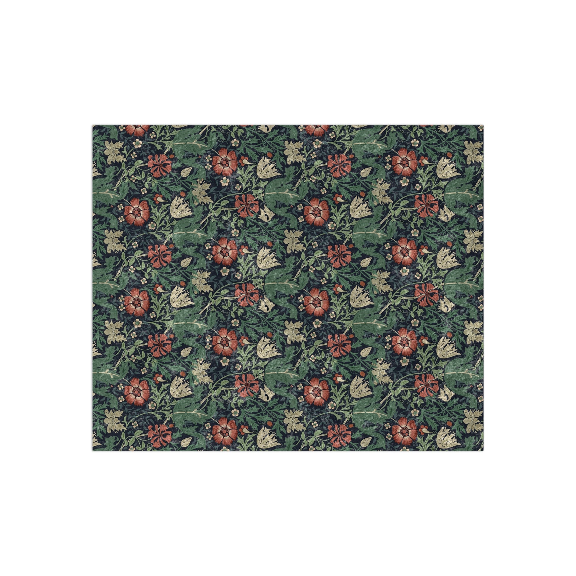 A lush crushed velvet blanket with a William Morris & Co floral pattern in green, red, and brown colours, displayed on a white background.