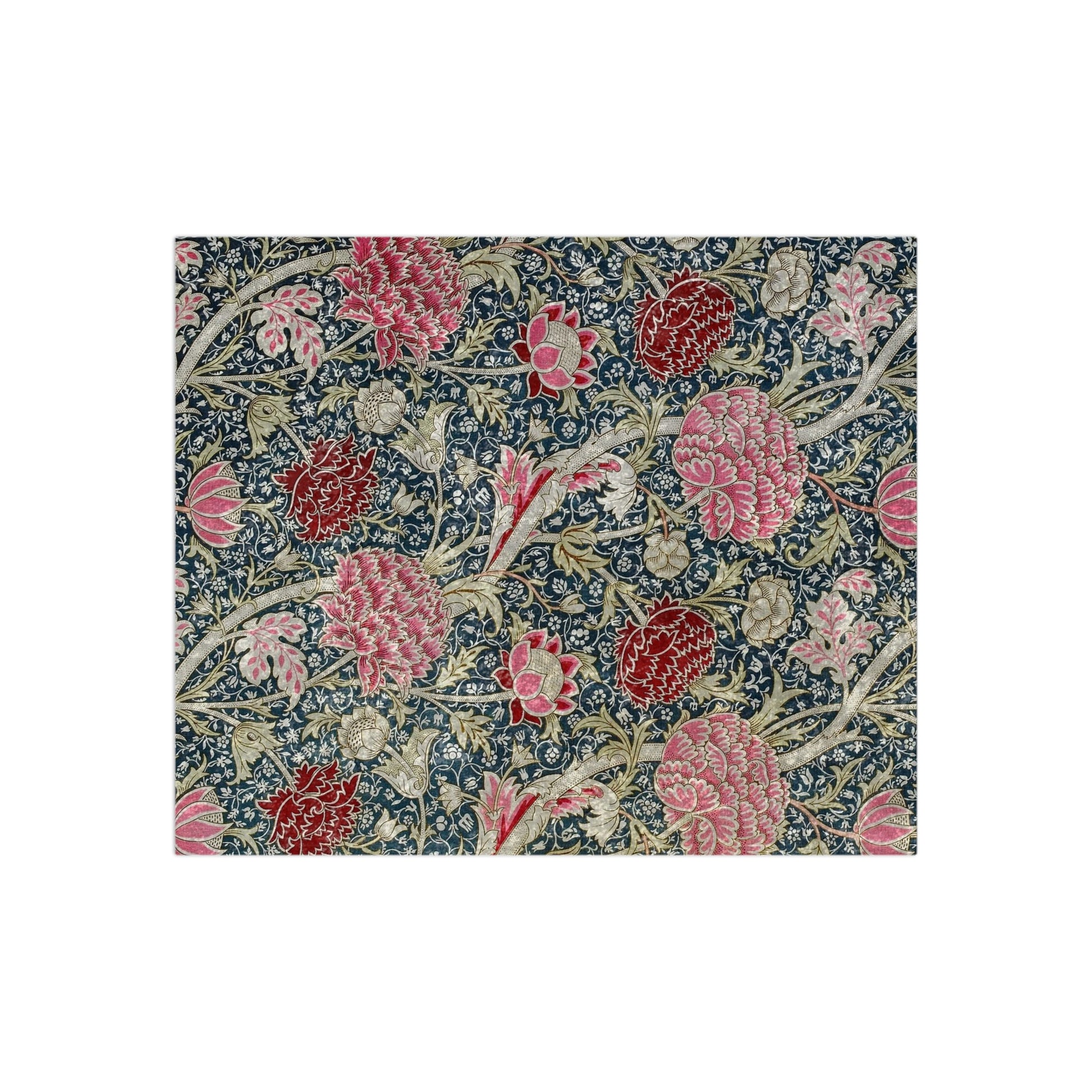 A lush crushed velvet blanket with a William Morris & Co floral pattern in shades of red, blue, and green, hemmed edges and a silky finish.