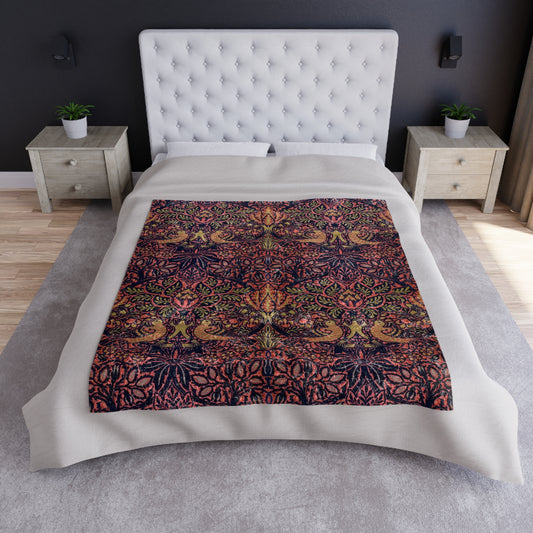 A crushed velvet blanket with a floral William Morris & Co pattern in shades of pink and burgundy, hemmed edges, and a silky finish.