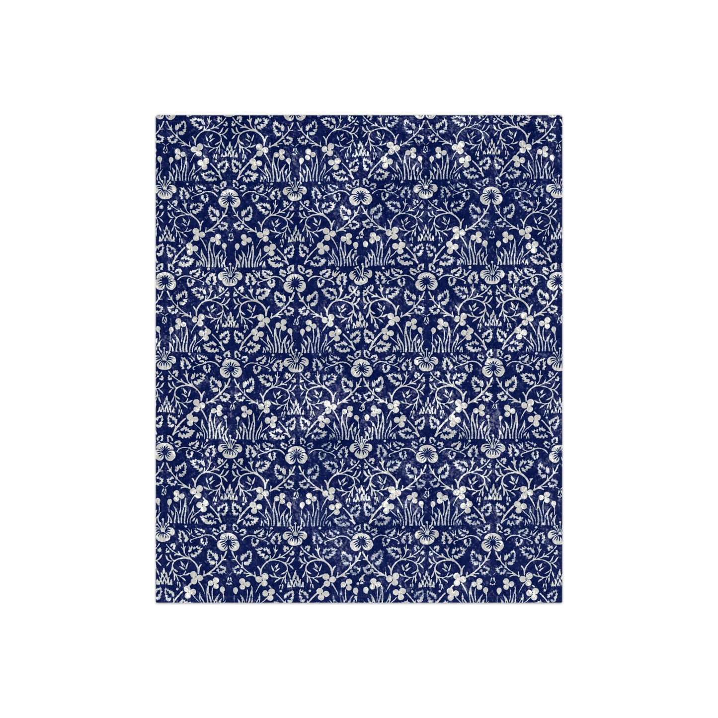 A blue and white patterned velvet blanket inspired by William Morris' Eyebright Collection.