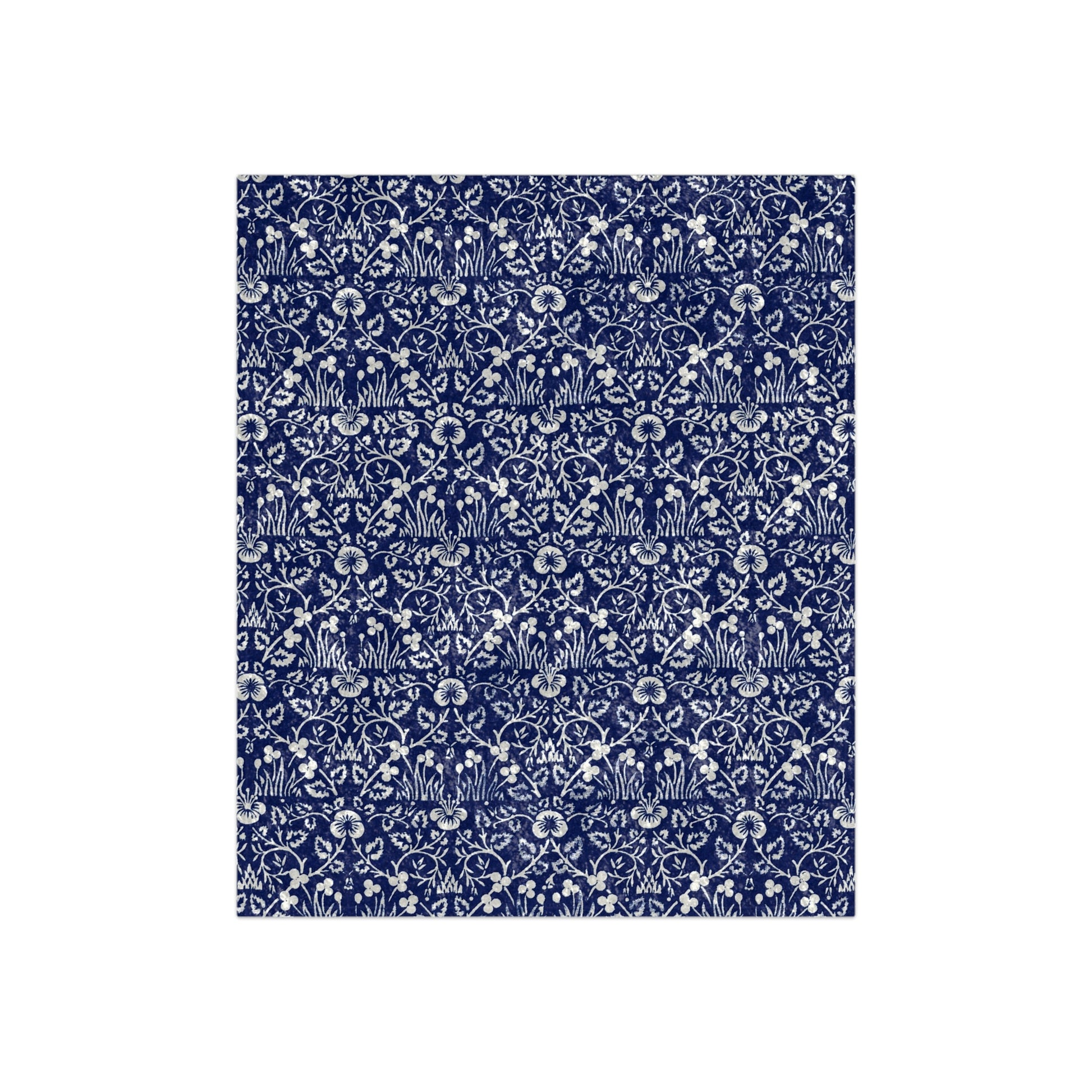 A blue and white patterned velvet blanket inspired by William Morris' Eyebright Collection.