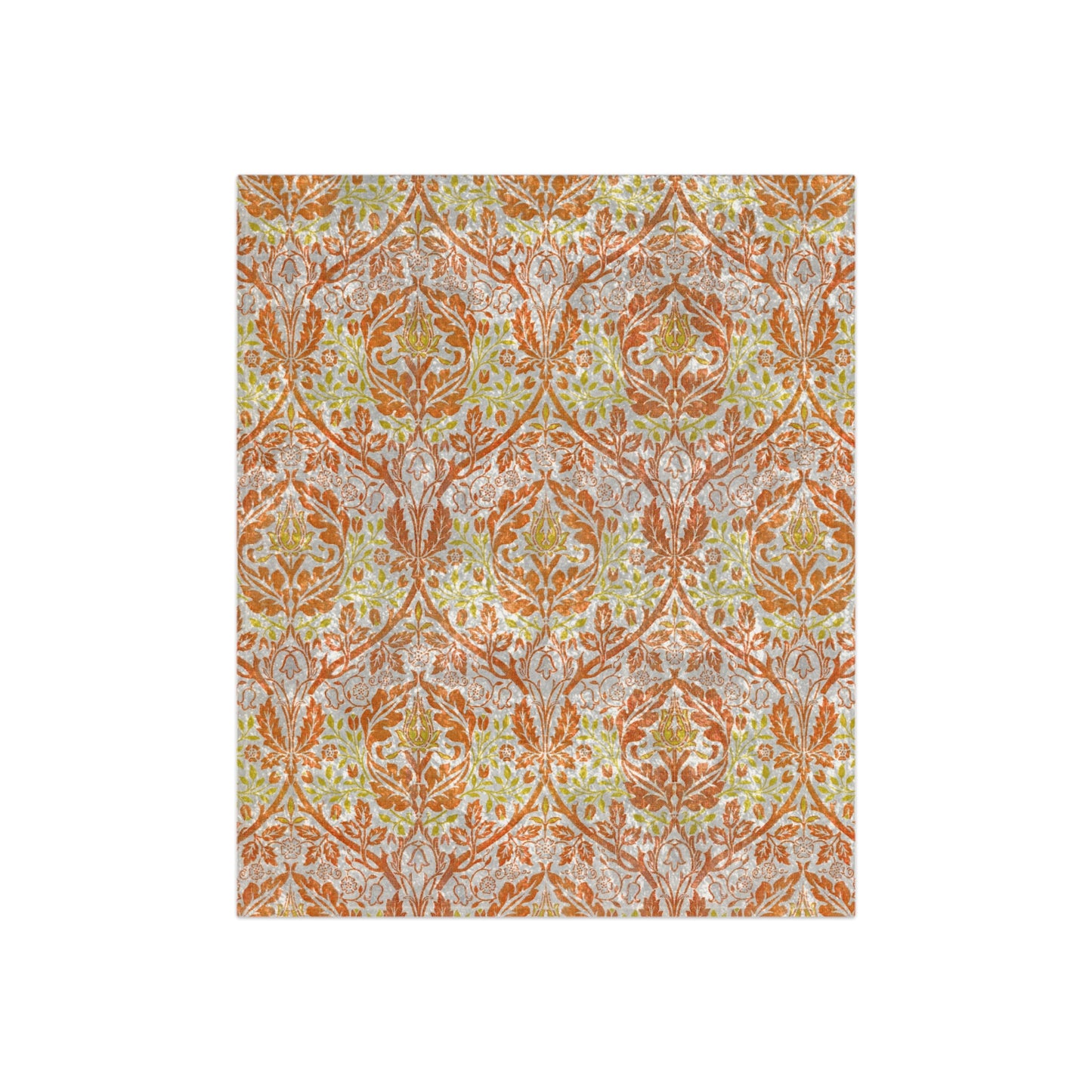 A crushed velvet blanket with a William Morris & Co floral pattern in shades of orange, yellow, and green on a white background, folded to show both the patterned side and the solid silky finish.