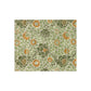 A plush, velvet blanket with aWilliam Morris  floral pattern in shades of green and orange, folded to show both the front and back with hemmed edges.