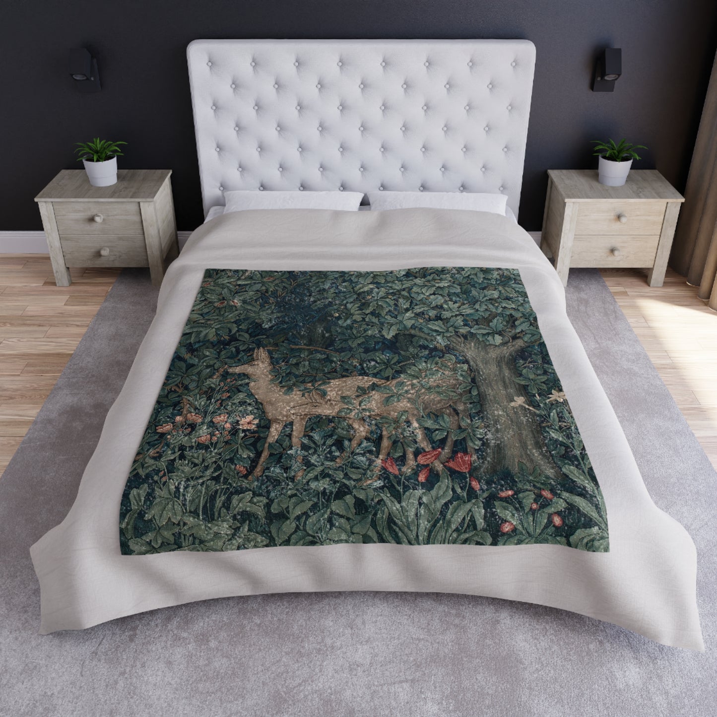 A lush crushed velvet blanket with a greenery design, inspired by William Morris, with hemmed edges and a silky finish.