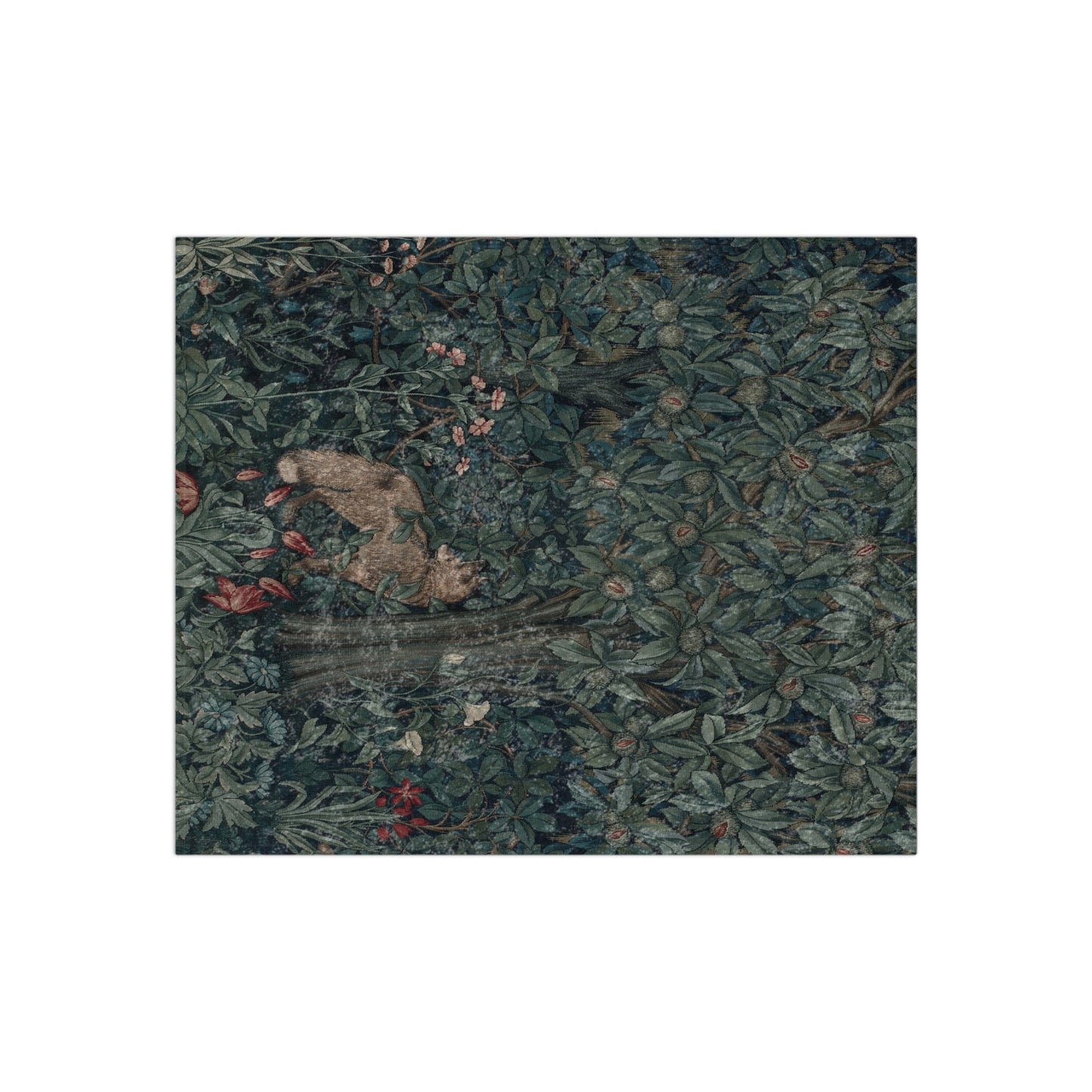 A plush velvet blanket with a William Morris & Co greenery (including leaves and fox) pattern on one side and a solid white colour on the reverse side, with hemmed edges.