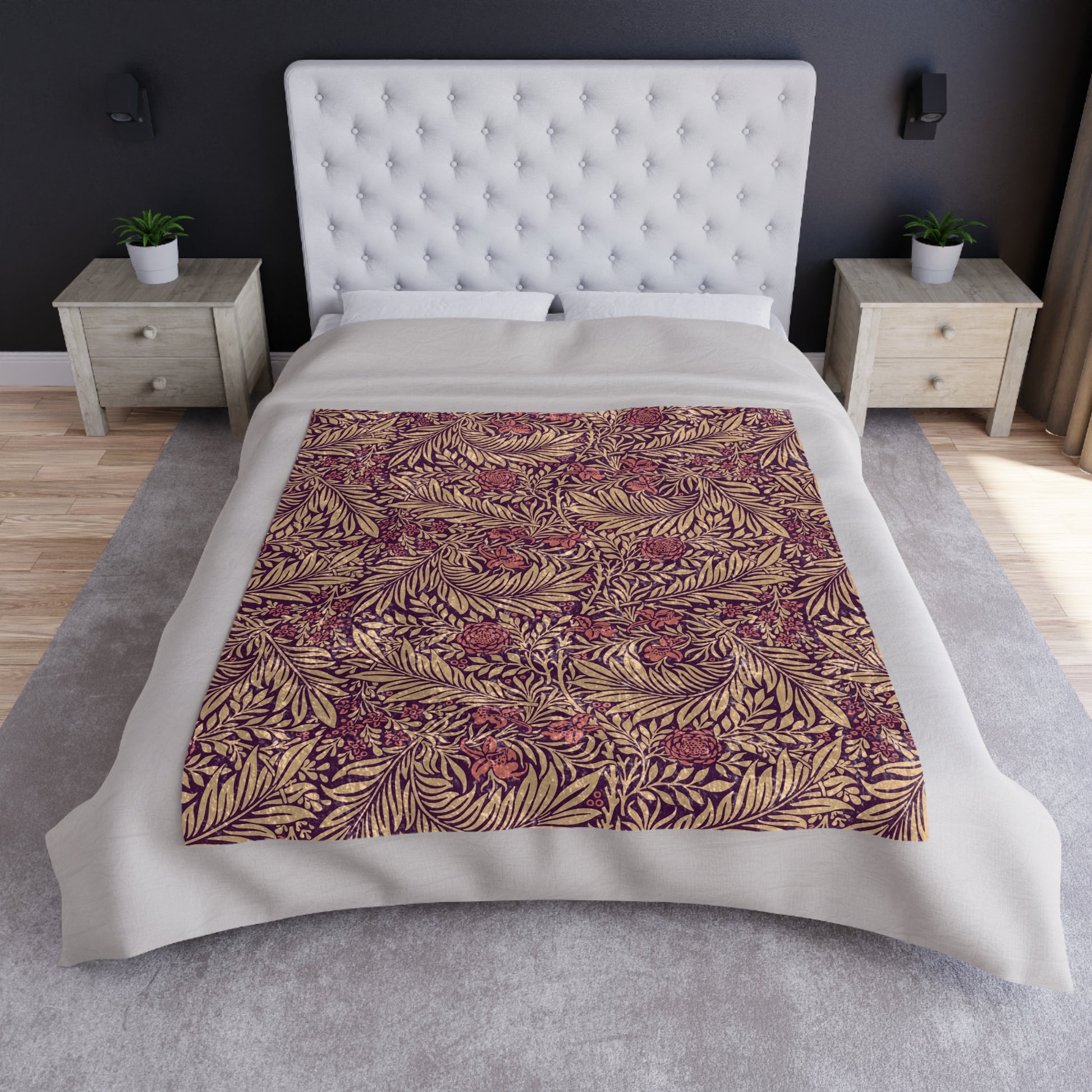 A red and brown William Morris & Co  floral patterned velvet blanket with hemmed edges and a silky finish.