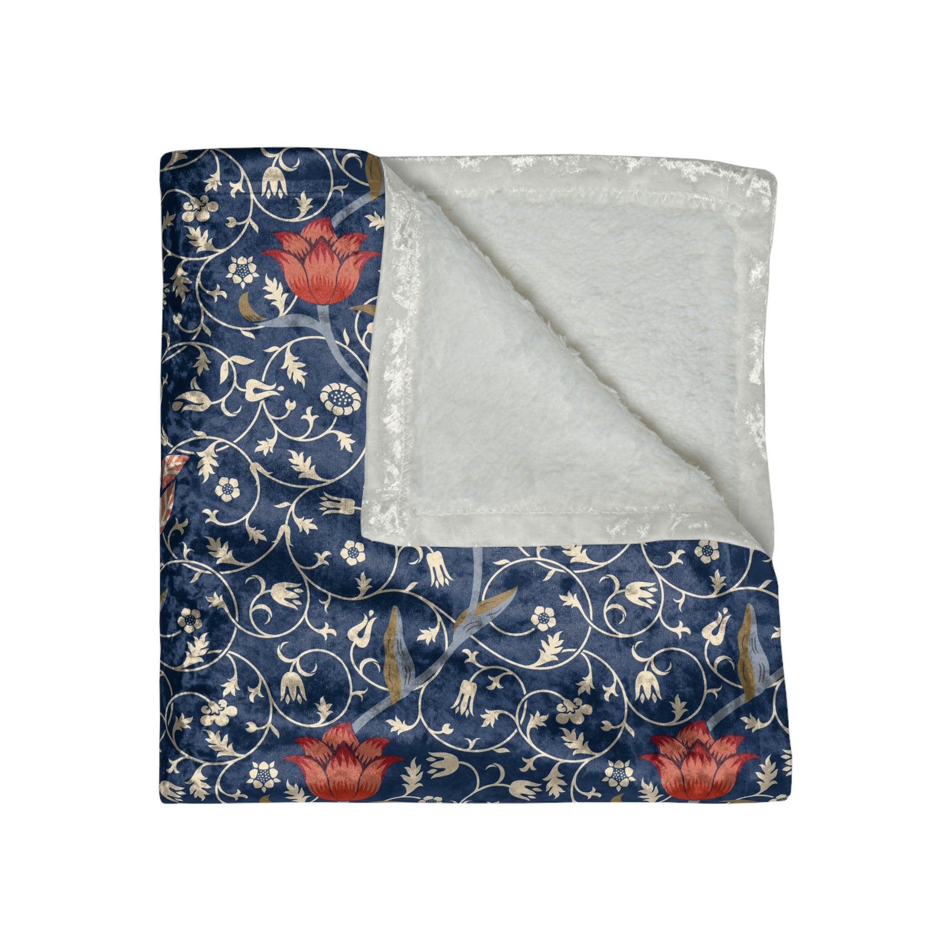 A lush crushed velvet blanket with a William Morris & Co floral pattern in blue and red colours, inspired by William Morris, with a silky finish.