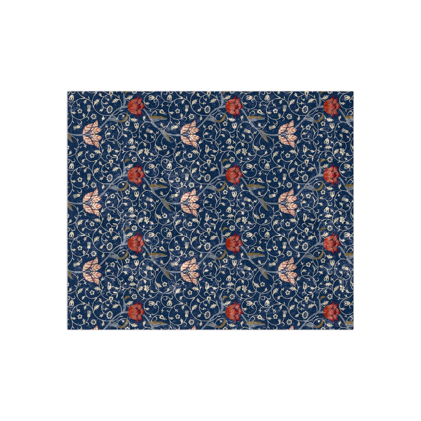 A lush crushed velvet blanket with a William Morris & Co floral pattern in blue and red colours, inspired by William Morris, with a silky finish.