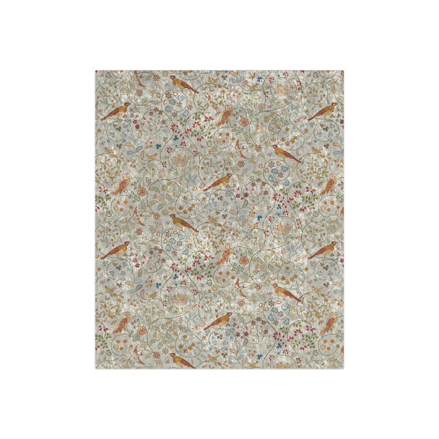 A plush, floral patterned velvet blanket in shades of green, pink, and brown with hemmed edges.