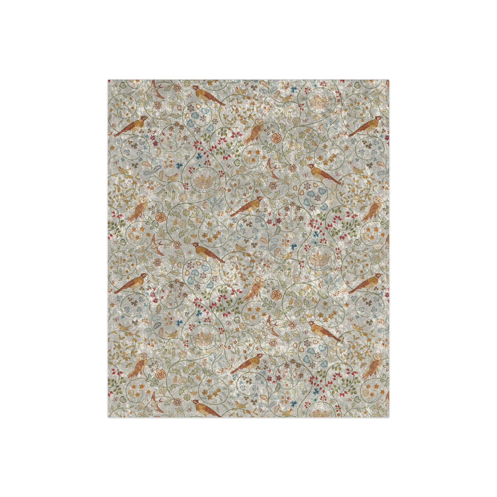 A plush, floral patterned velvet blanket in shades of green, pink, and brown with hemmed edges.