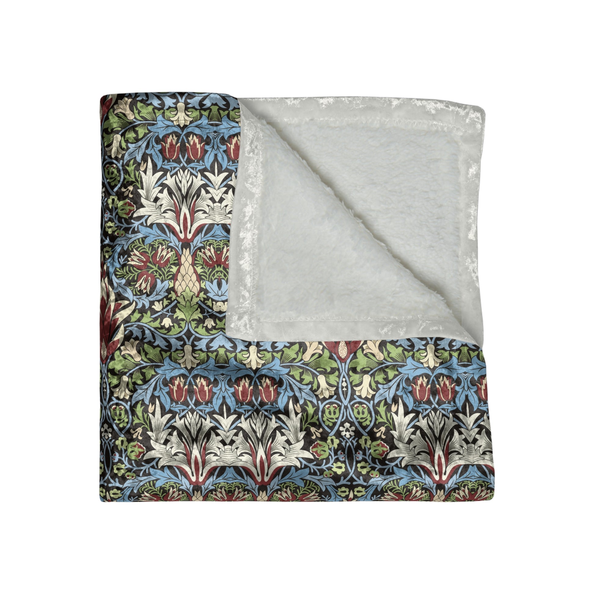 Floral patterned blanket with a gray reverse side on a white background