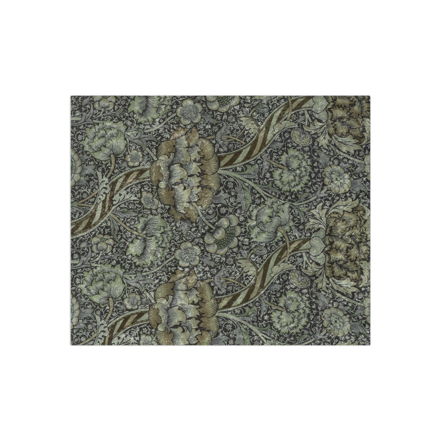 A crushed velvet blanket with a floral pattern in muted colors, folded to show both the patterned side and the solid gray reverse.