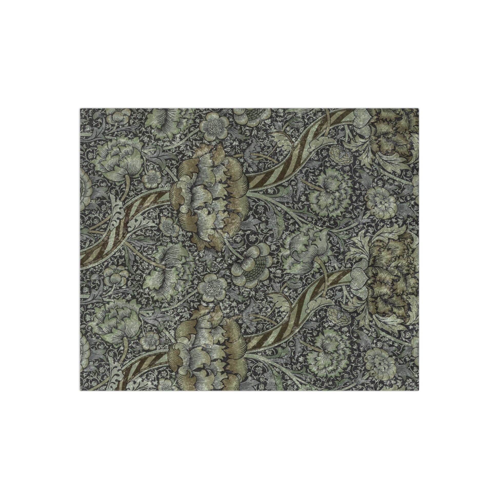 A crushed velvet blanket with a floral pattern in muted colors, folded to show both the patterned side and the solid gray reverse.