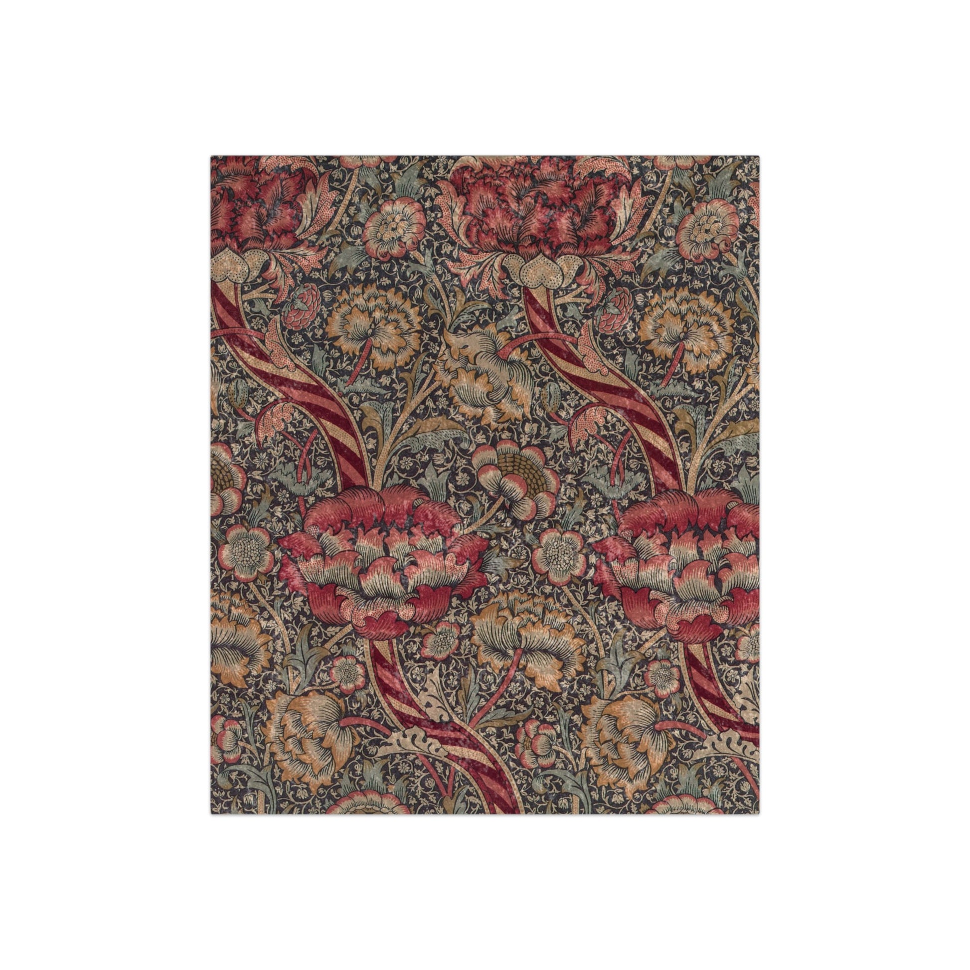 A lush crushed velvet blanket with a floral pattern in red and green colors inspired by William Morris - Wandle Collection.