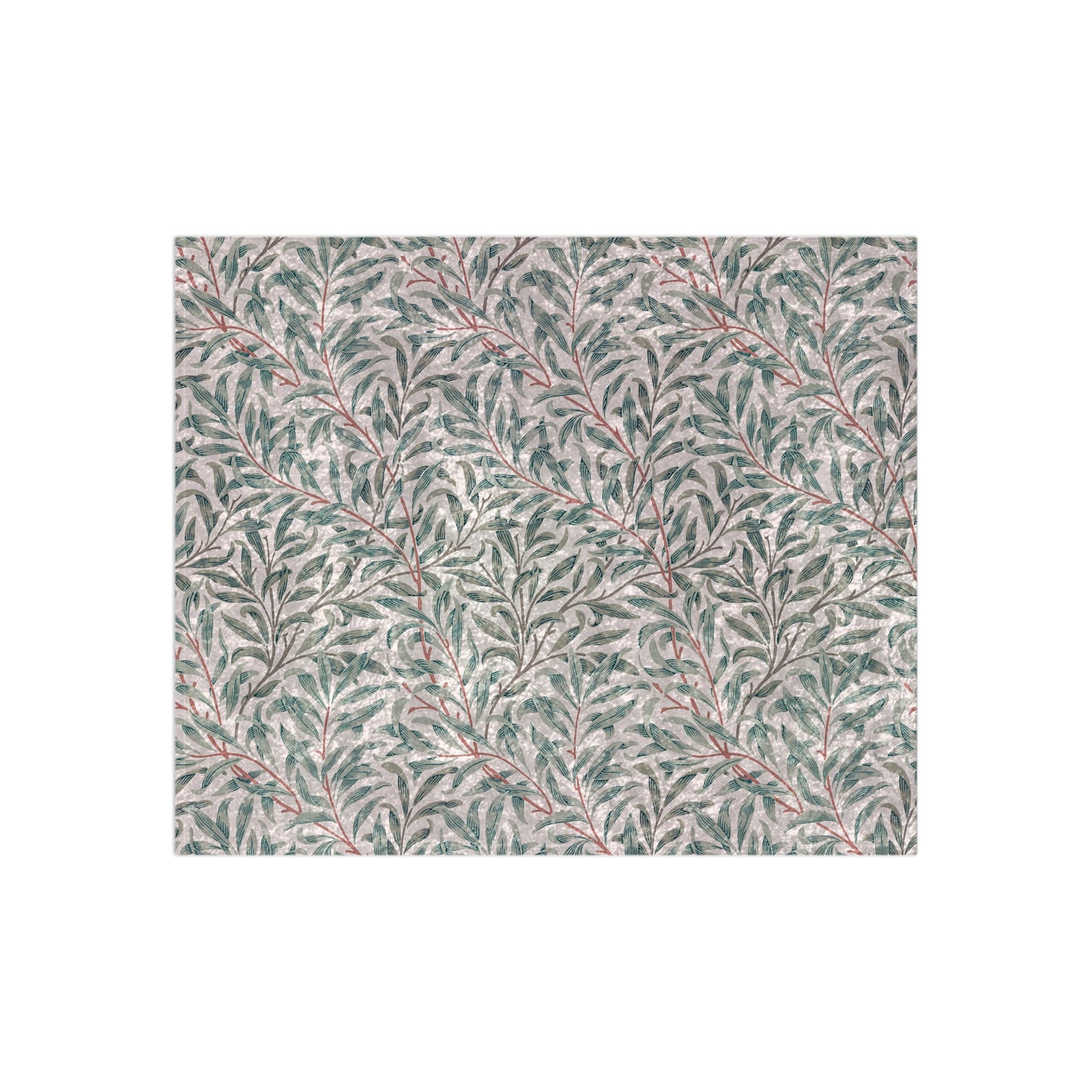 A crushed velvet blanket with a floral William Morris & Co pattern in green and red on a white background, hemmed edges, and a silky finish.