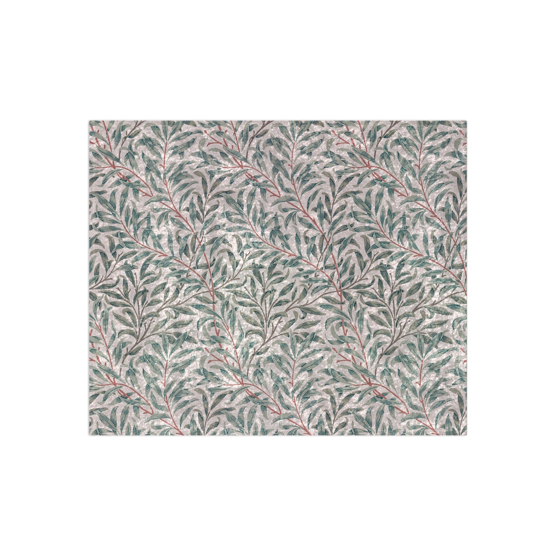 A crushed velvet blanket with a floral William Morris & Co pattern in green and red on a white background, hemmed edges, and a silky finish.