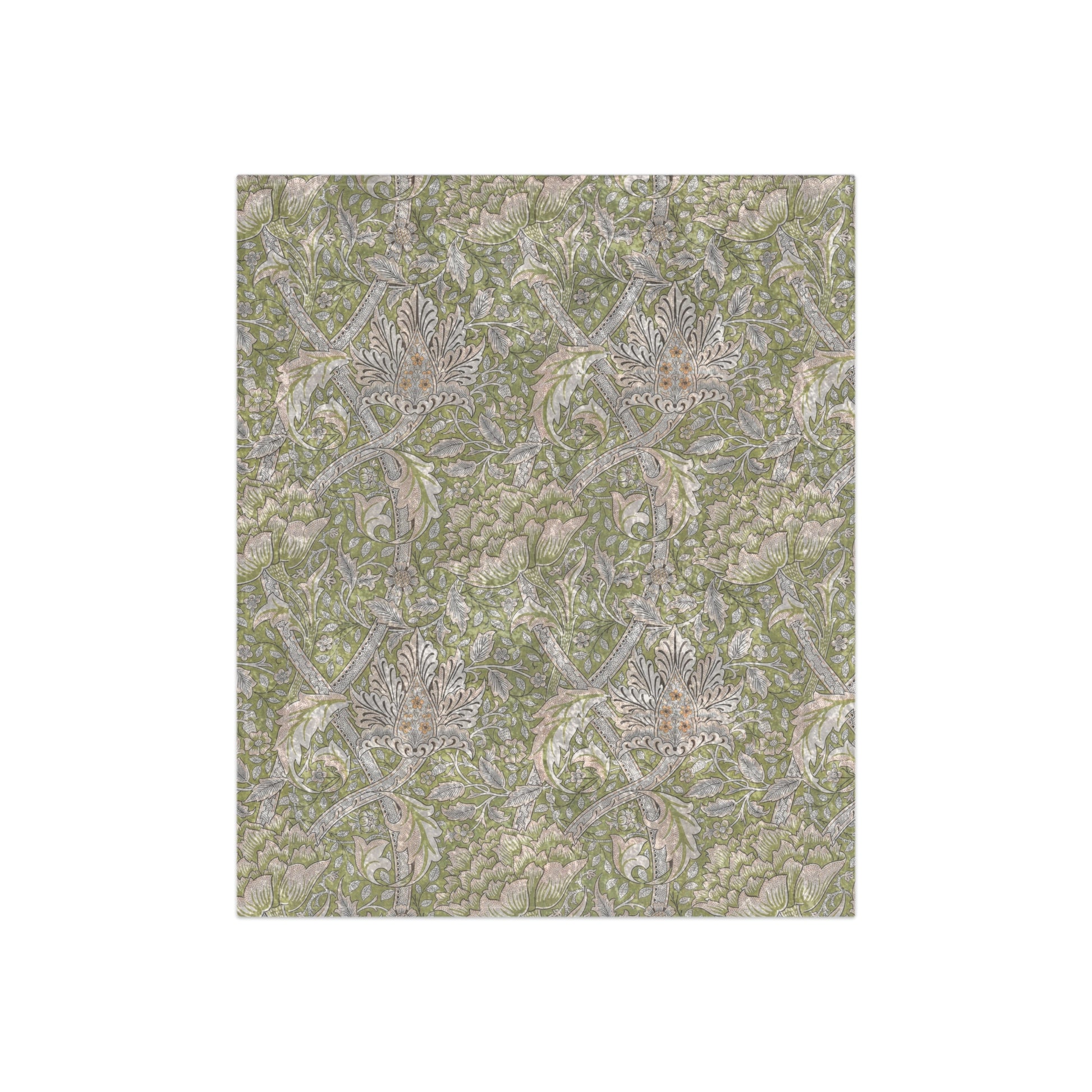 A plush, velvet blanket with a floral pattern in shades of green and beige, laid out with the soft side up.
