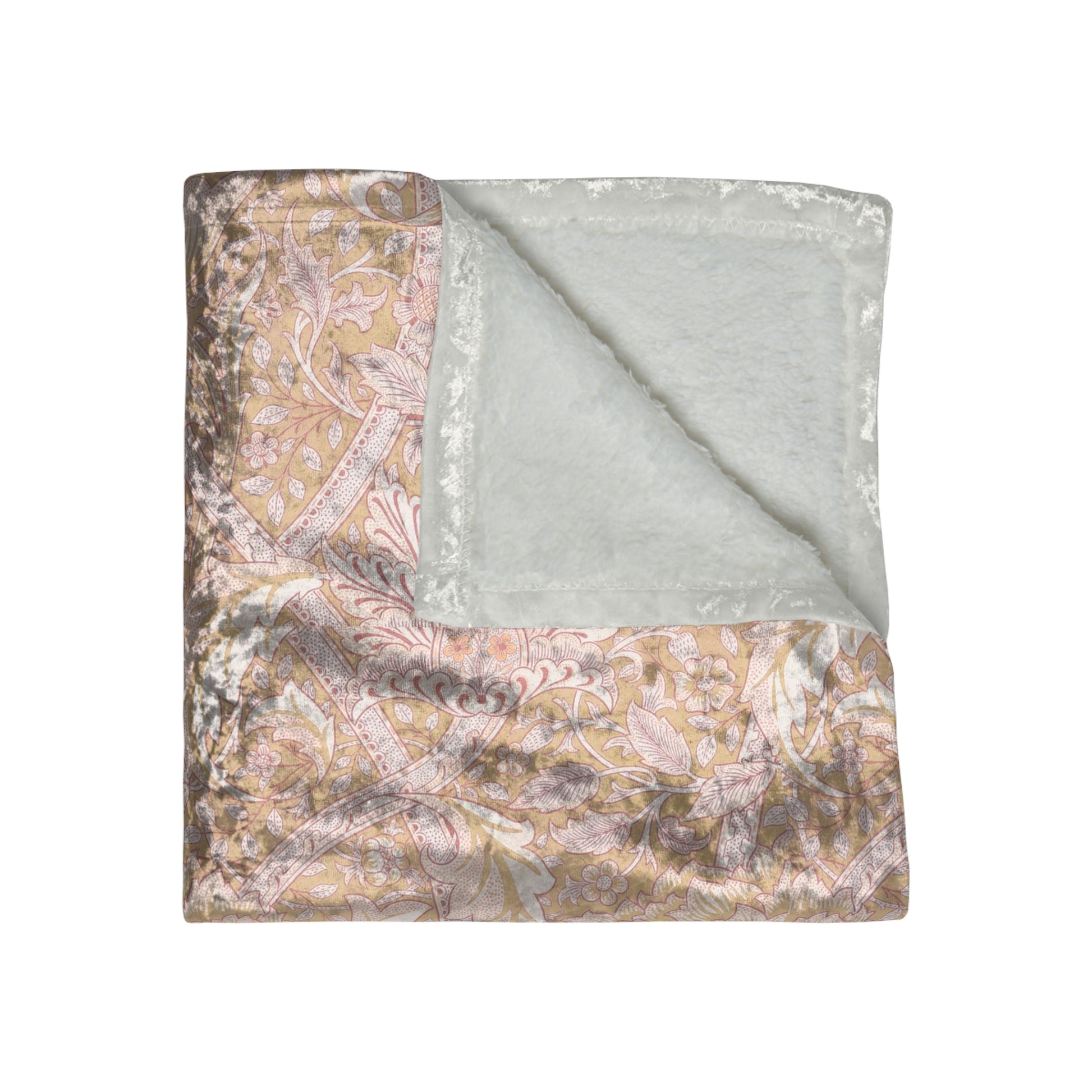 A plush, velvet blanket with a floral William Morris & Co pattern in muted colours, folded to show both the front and back.
