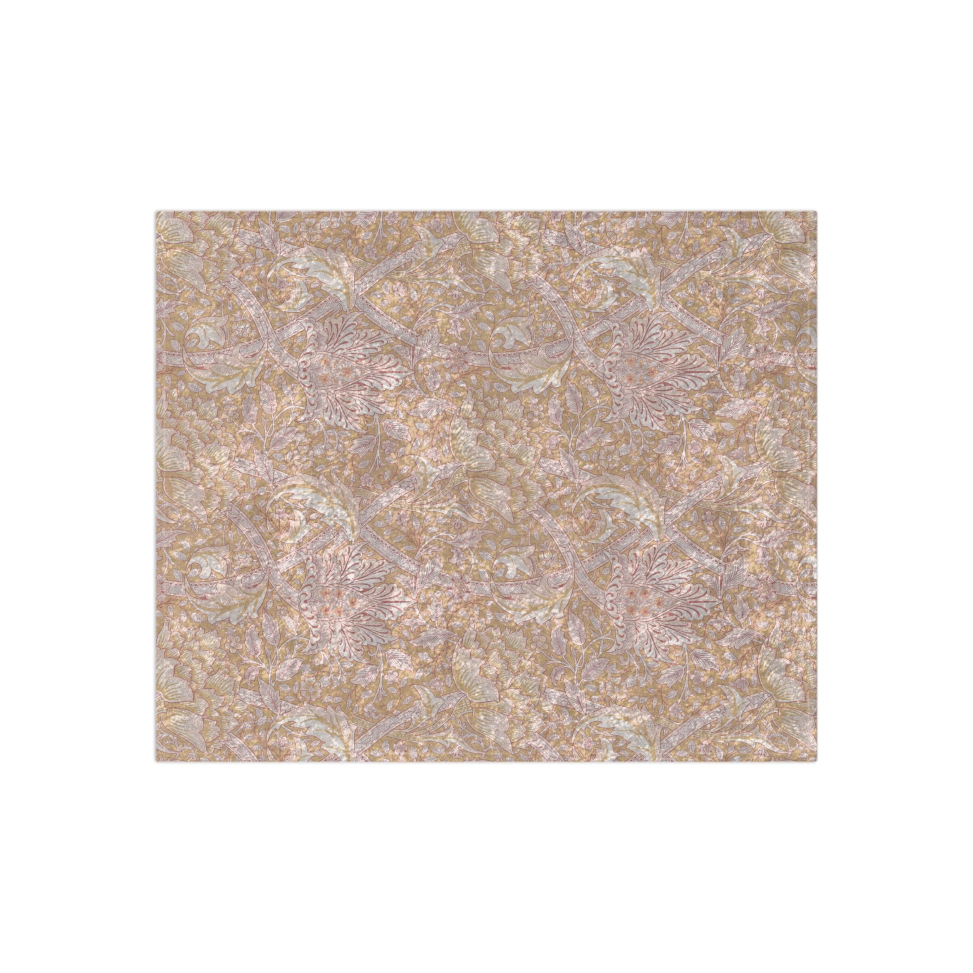 A plush, velvet blanket with a floral William Morris & Co pattern in muted colours, folded to show both the front and back.