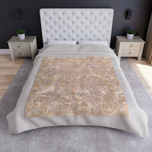 A plush, velvet blanket with a floral William Morris & Co pattern in muted colours, folded to show both the front and back.