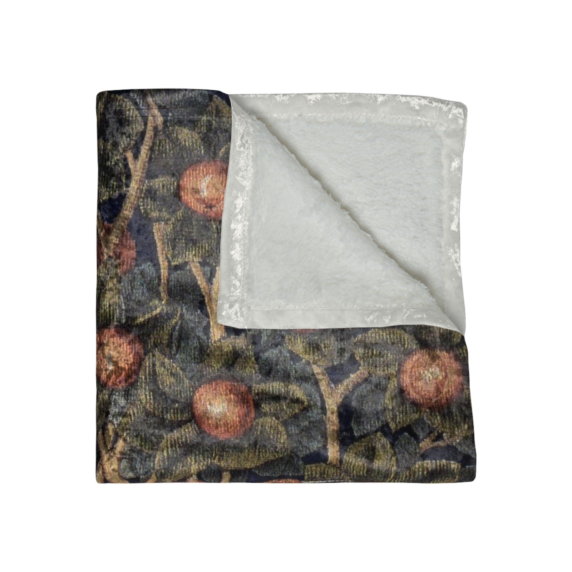 A lush crushed velvet blanket with a floral pattern inspired by William Morris, displayed in an folded arrangement to show both the patterned side and the silky finish.