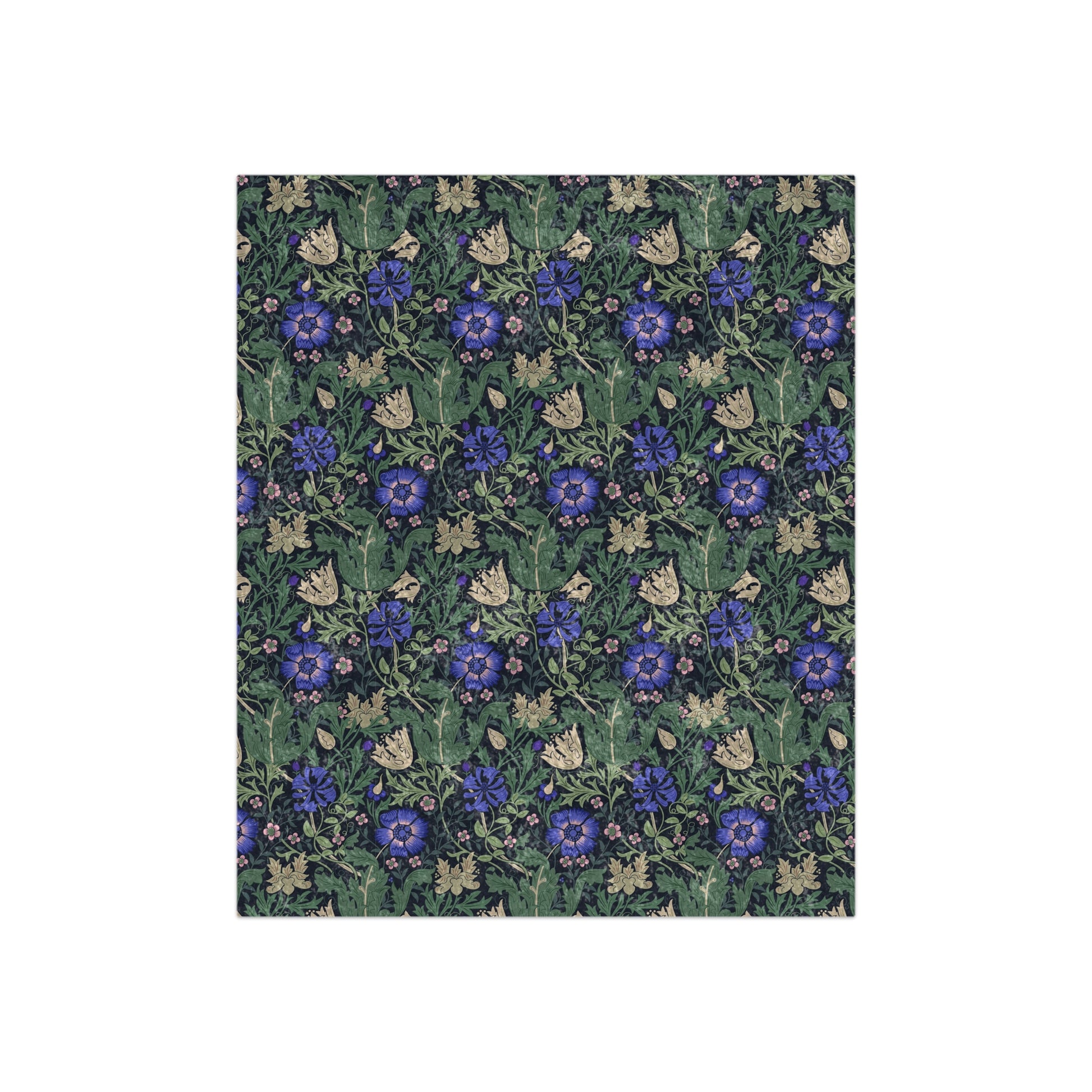 A rectangular blanket with a floral pattern inspired by William Morris, featuring shades of blue, green, and beige.