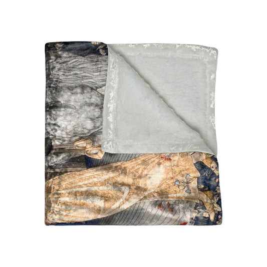 A crushed velvet blanket with a geometric pattern in a mix of dark and light colors, folded in half to show both sides.