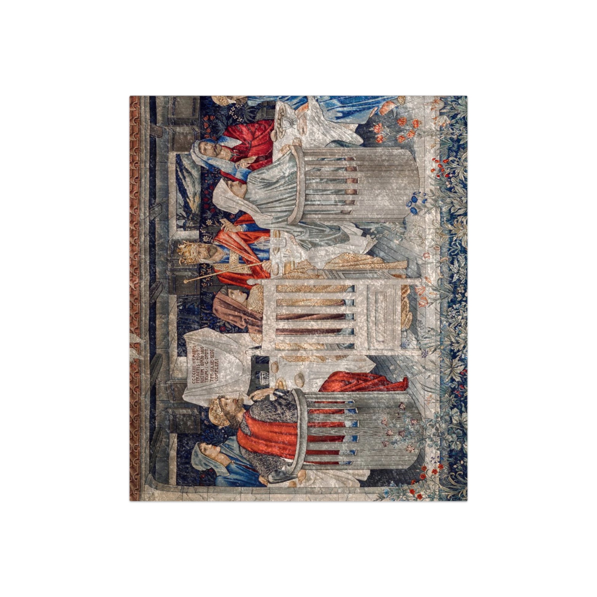 A plush velvet blanket with a geometric pattern in a mix of gray, blue, and green colors, laid out flat.