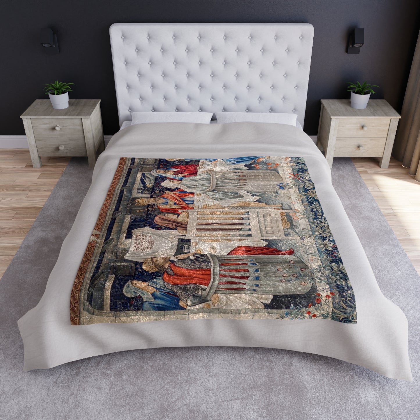 A plush velvet blanket with a geometric William Morris & Co pattern in a mix of gray, blue, and green colours, laid out flat.