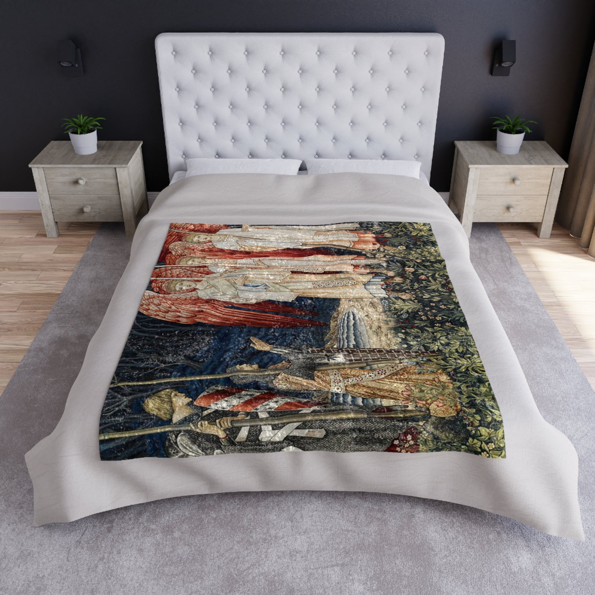 A crushed velvet blanket with a pattern inspired by William Morris' Holy Grail Collection, featuring red angels and other historical figures.