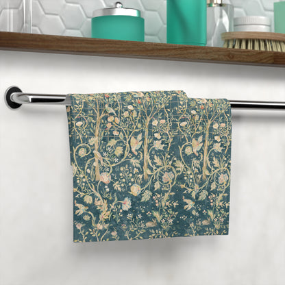 Floral patterned washcloth hanging on a rack in a bathroom setting.