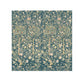 Decorative washcloth with floral and tree pattern on a blue background