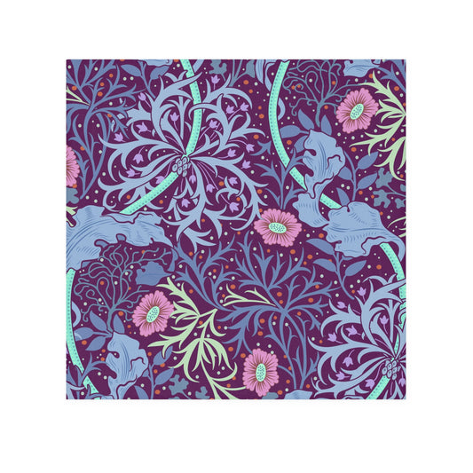 A multicolored floral patterned washcloth inspired by William Morris' Seaweed Collection with a pink flower motif.
