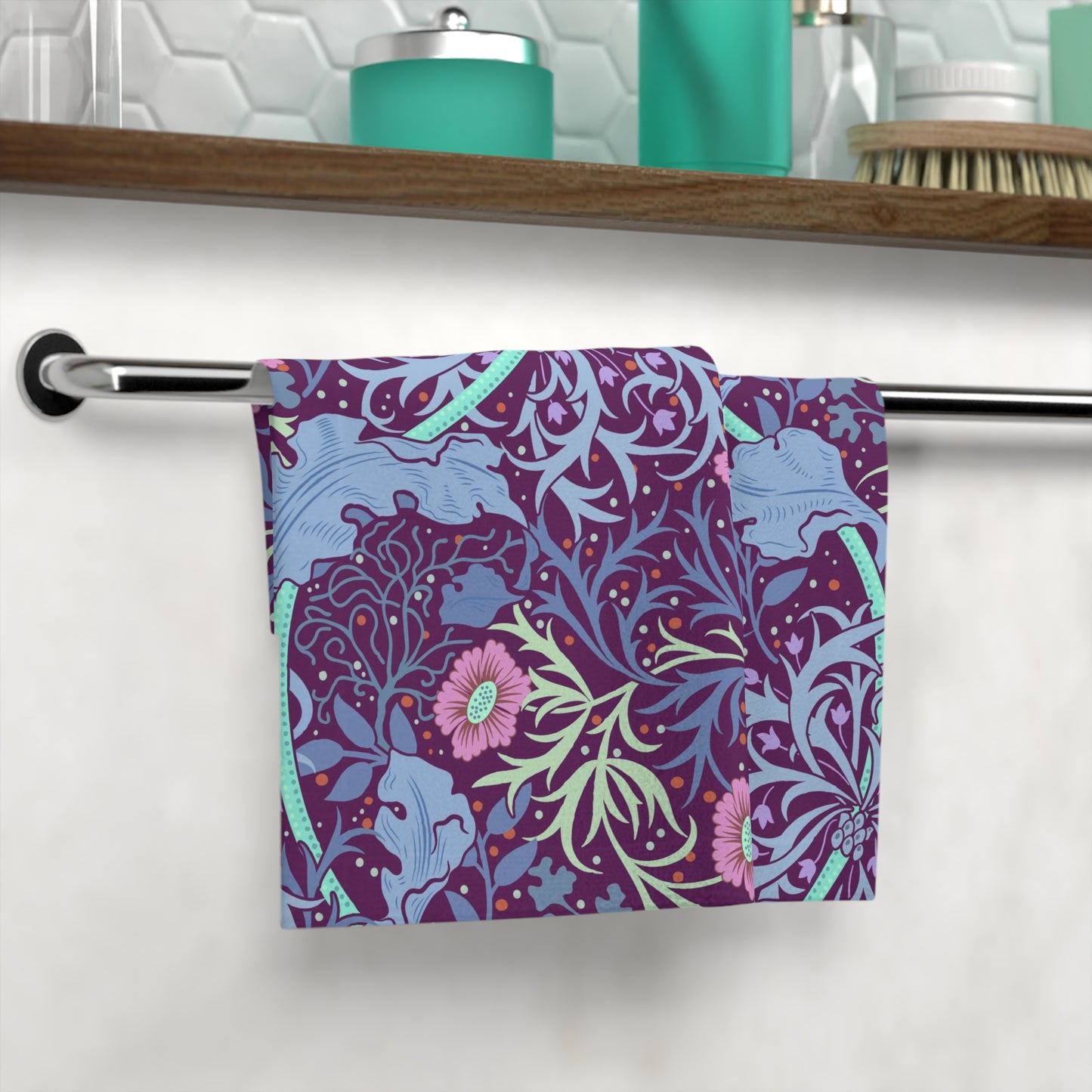 A multicolored floral patterned washcloth inspired by William Morris' Seaweed Collection with a pink flower motif.