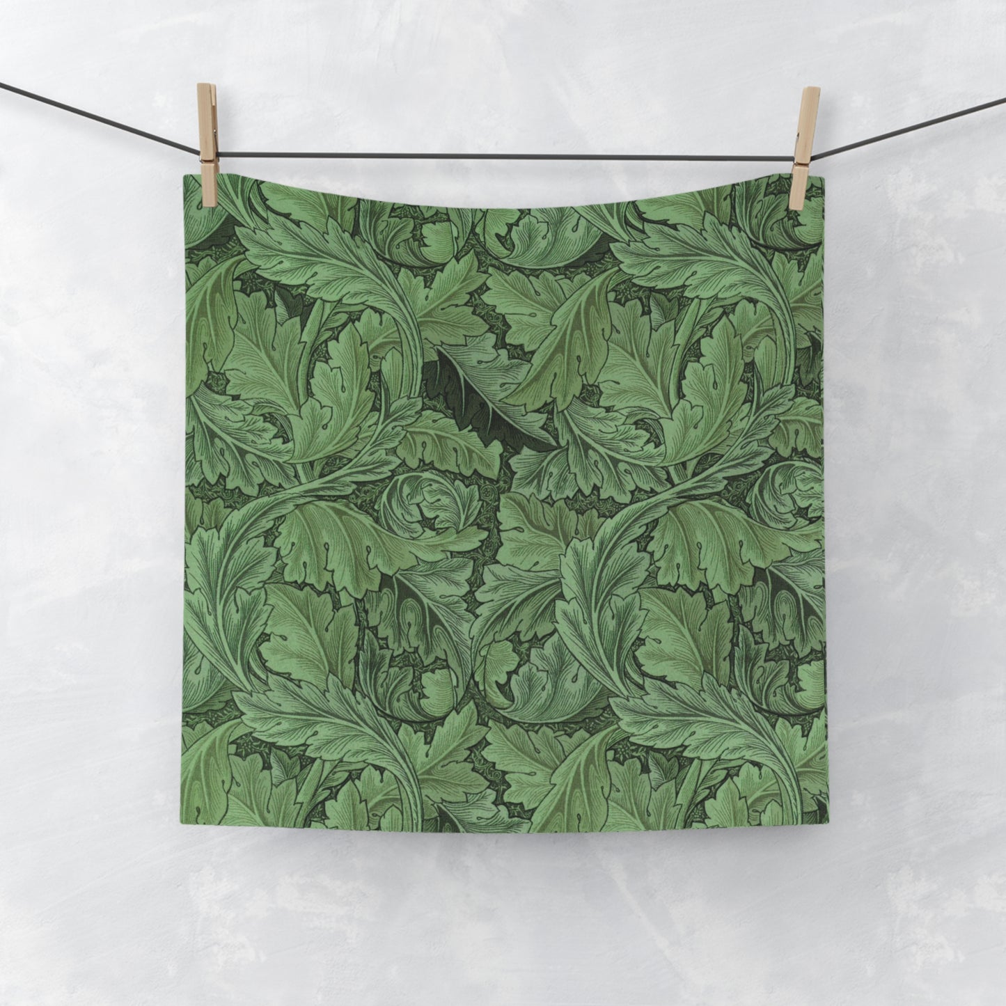 A green floral patterned washcloth inspired by William Morris' Acanthus Collection.