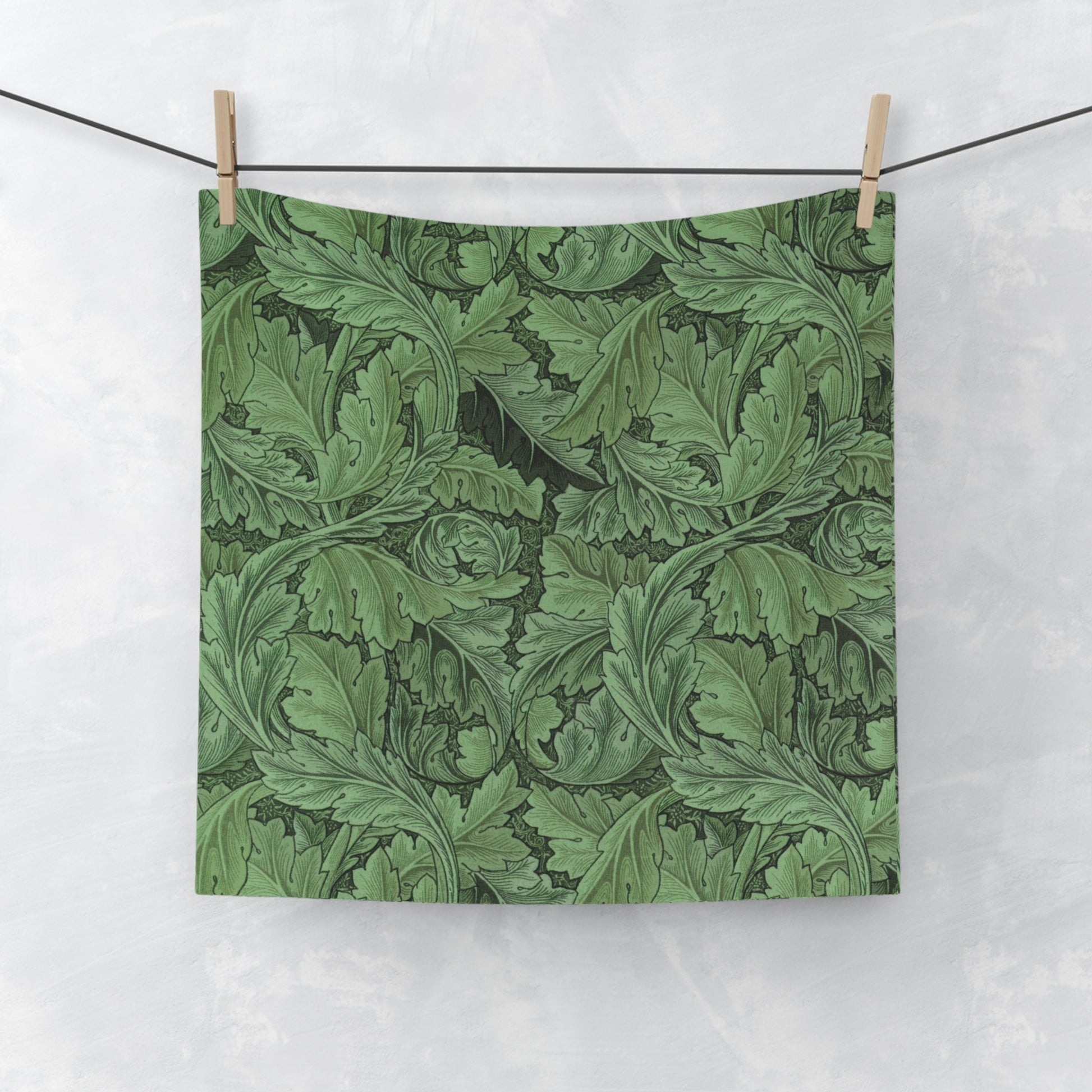 A green floral patterned washcloth inspired by William Morris' Acanthus Collection.