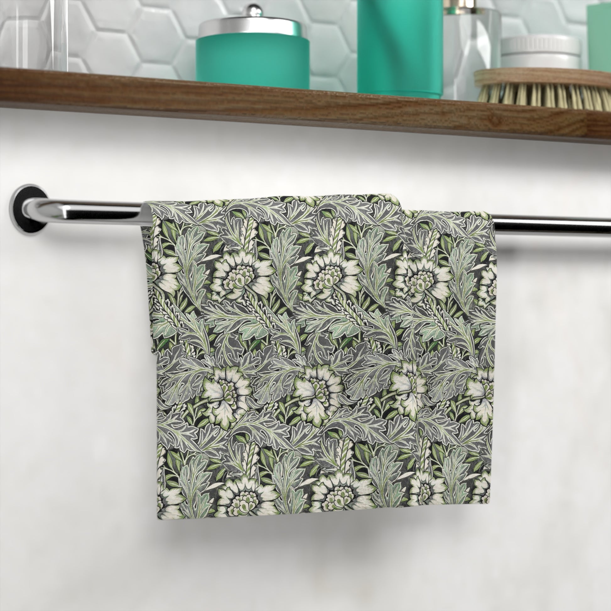 A gray washcloth with a floral pattern inspired by William Morris, featuring a design with leaves and anemone flowers.