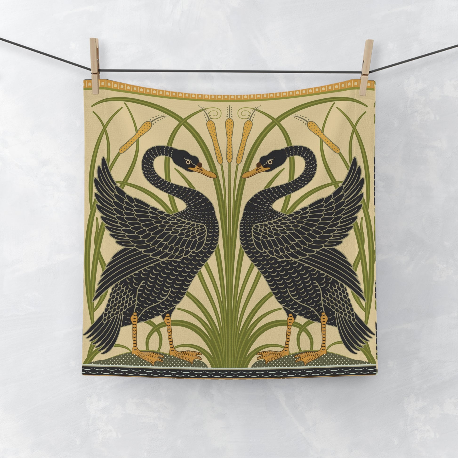 Tea towel with black swan design on a white background