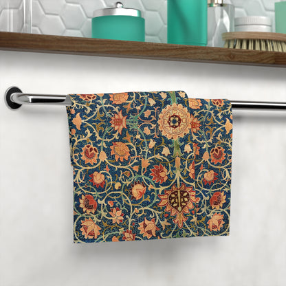 Decorative towel with floral pattern hanging on a rack in a bathroom.