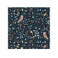 Patterned fabric with birds and leaves on a dark blue background