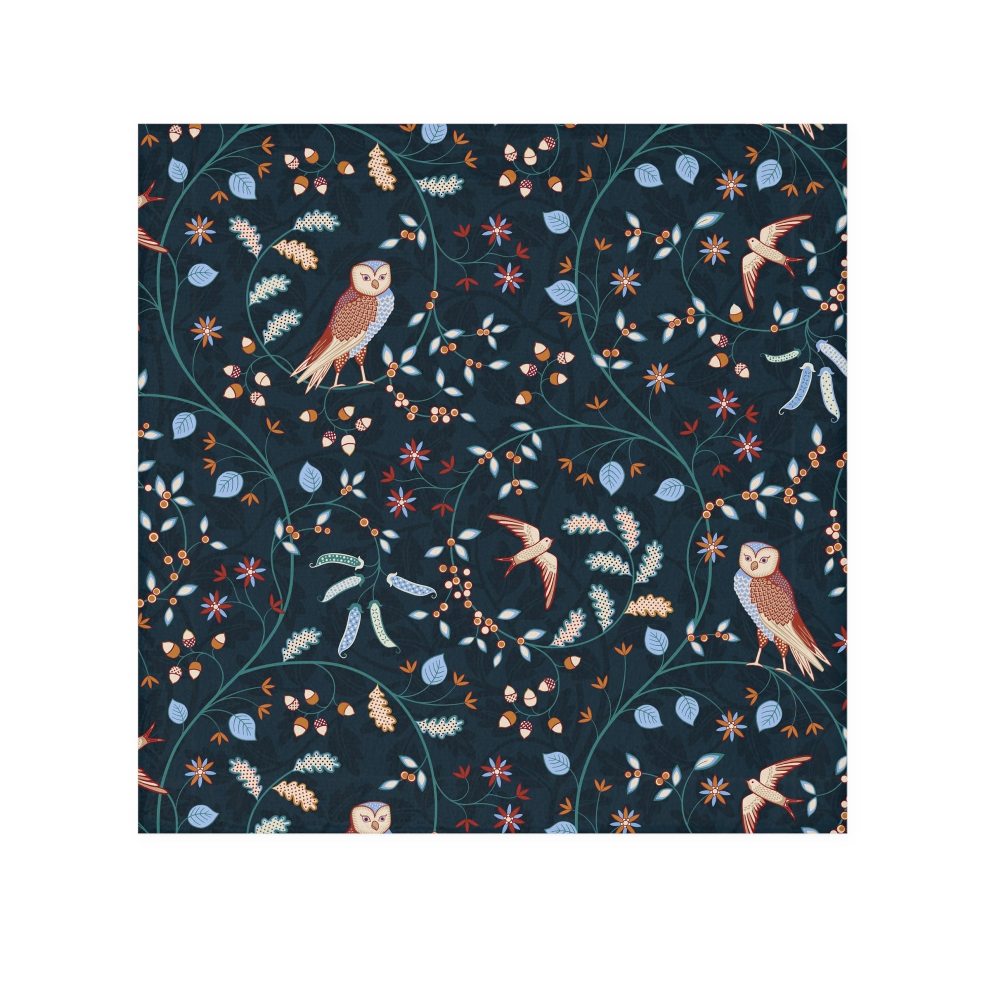 Patterned fabric with birds and leaves on a dark blue background