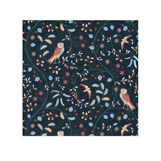 Patterned fabric with birds and leaves on a dark blue background