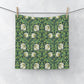 Floral patterned fabric hanging on a line against a white background