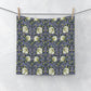 Floral patterned fabric hanging on a line against a white background