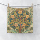 Floral patterned fabric hanging on a line against a white background