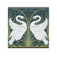 Decorative design with two white swans and green foliage on a blue background