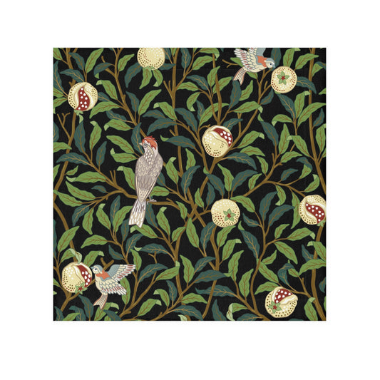 A white washcloth with a floral pattern featuring birds and pomegranates, inspired by the William Morris design.