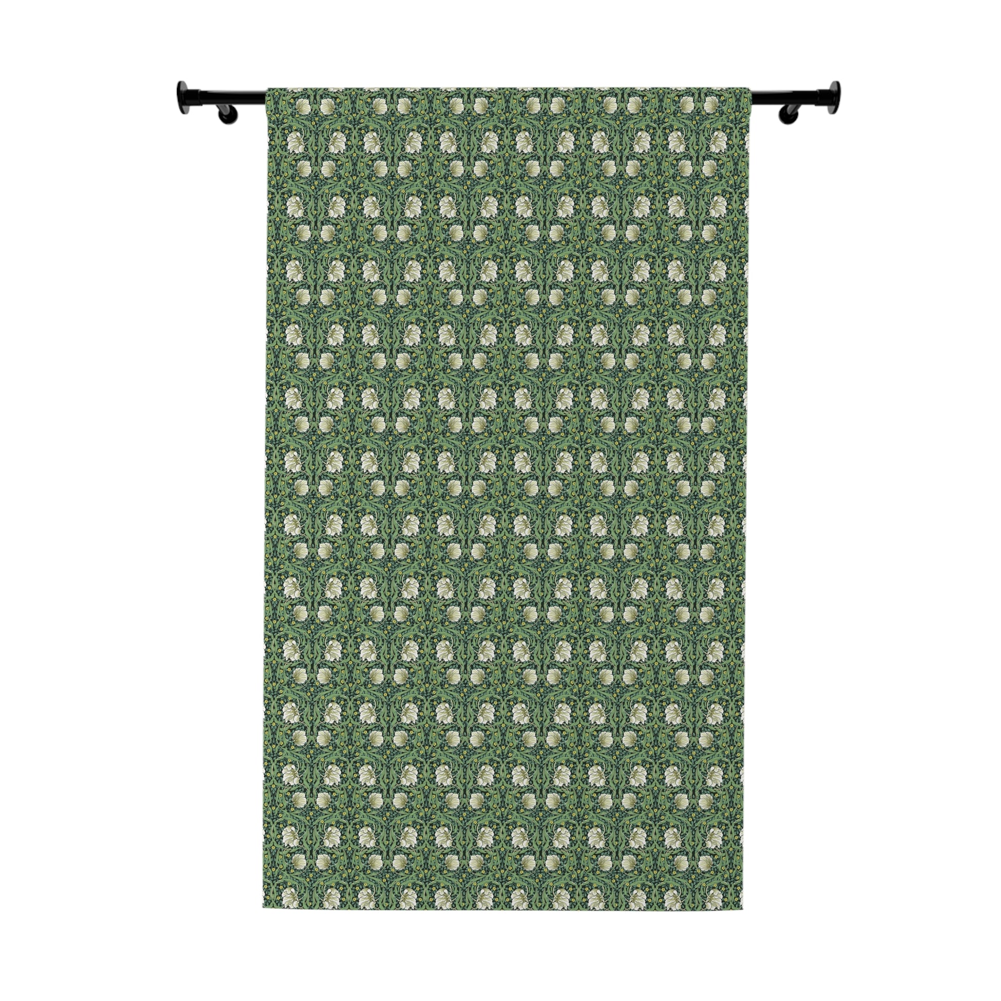 Green curtain with white floral pattern on a white background