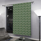 Green patterned curtain in a modern room with a lamp and chair.