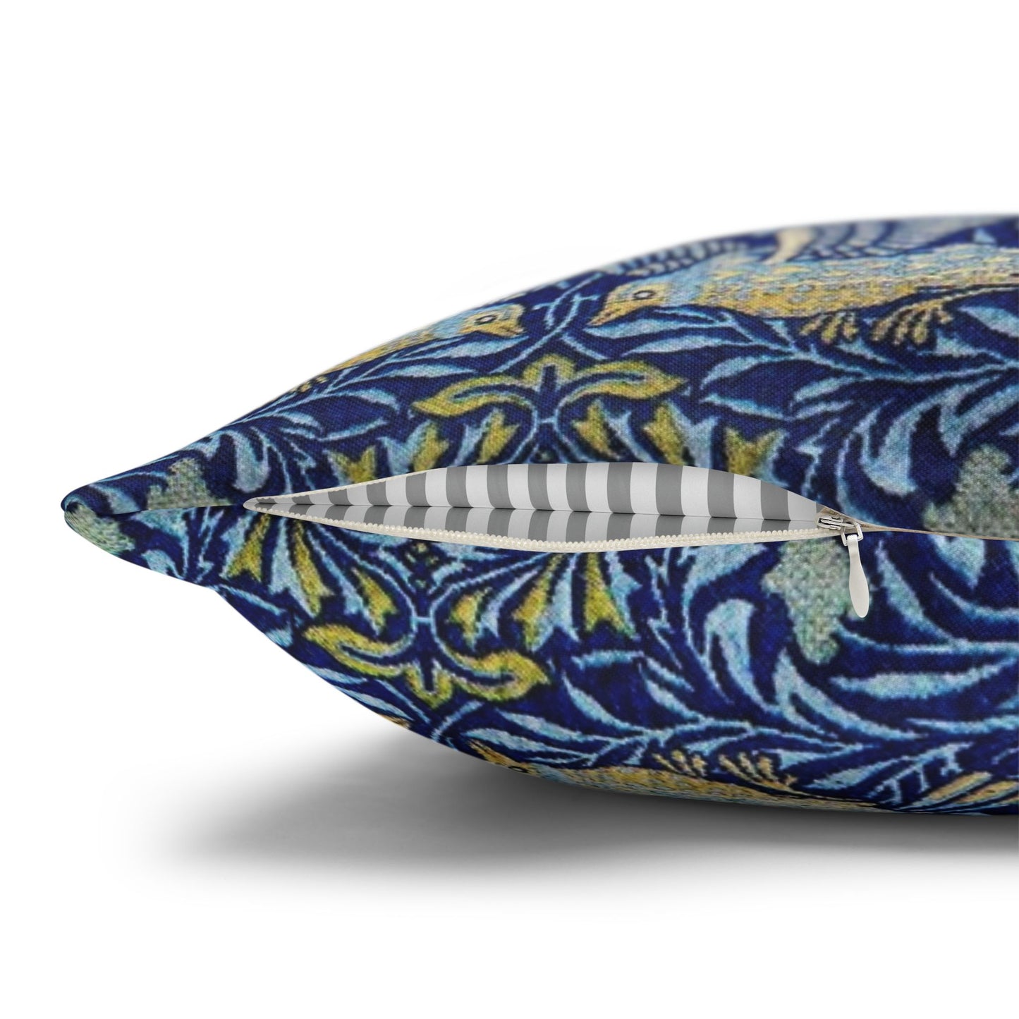 Decorative pillow with a blue and yellow pattern on a white background